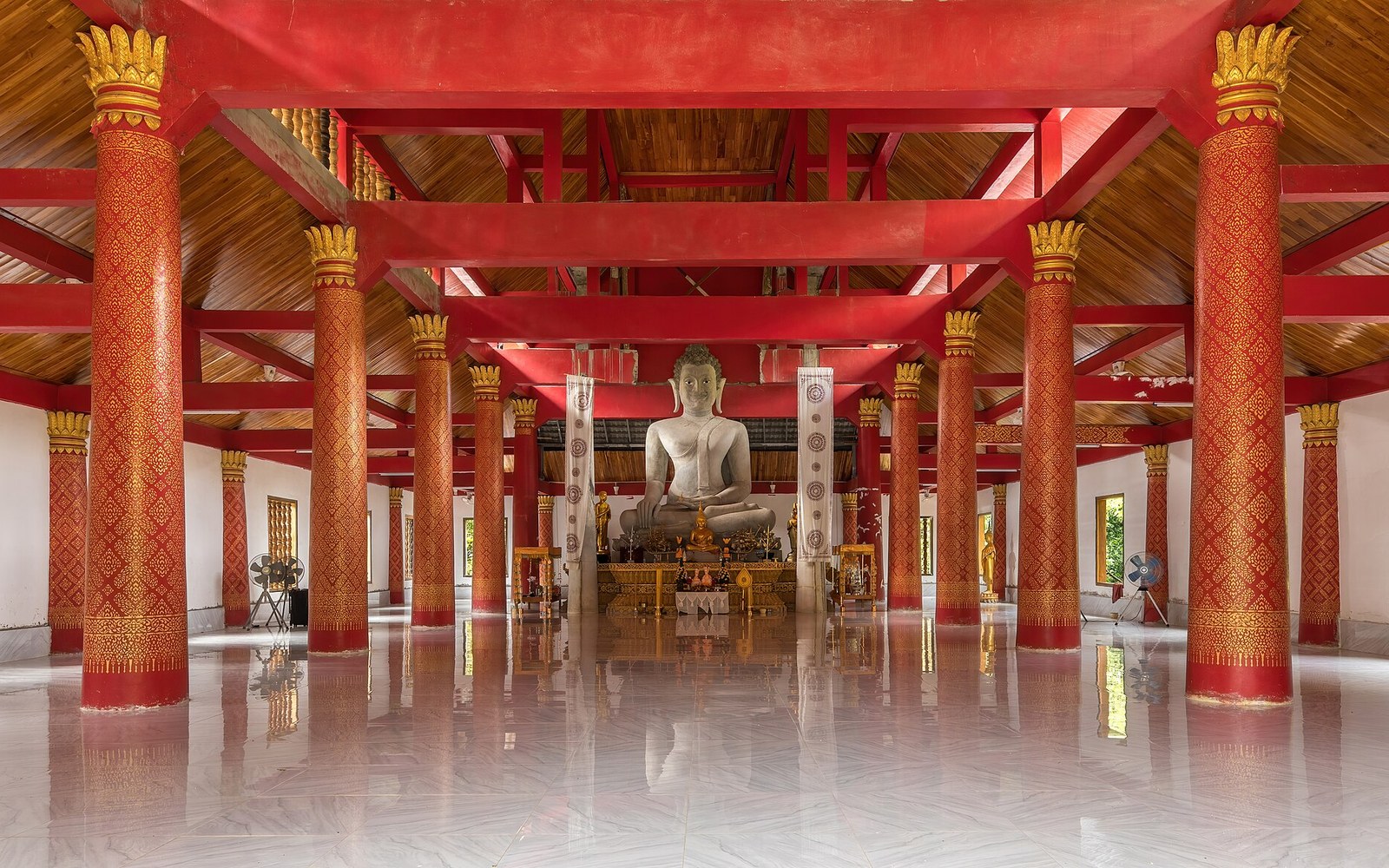 A quiet temple interior with mats laid out